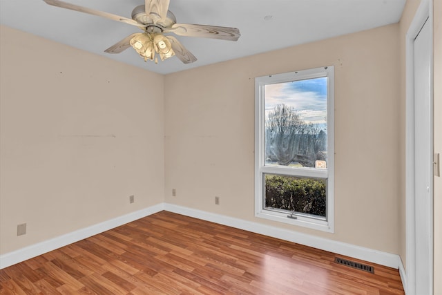 empty room with light hardwood / wood-style flooring and ceiling fan