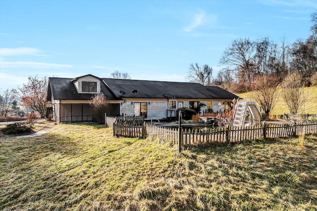 back of house with a yard