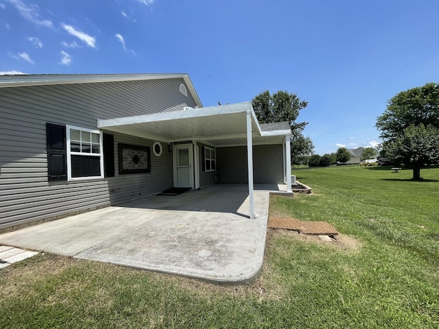 1830 Pheasant Crossing Dr, Dandridge, TN 37725 - rear view of property featuring a carport, a yard, and concrete driveway