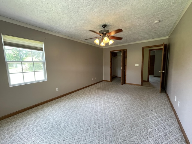 1830 Pheasant Crossing Dr, Dandridge, TN 37725 - unfurnished bedroom featuring crown molding, light carpet, a textured ceiling, a ceiling fan, and a closet