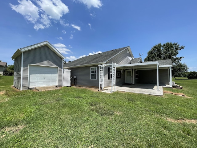 1830 Pheasant Crossing Dr, Dandridge, TN 37725 - rear view of property with a lawn, a patio area, a shingled roof, an outbuilding, and a garage
