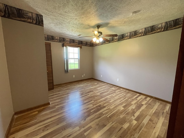 1830 Pheasant Crossing Dr, Dandridge, TN 37725 - unfurnished room featuring a ceiling fan, a textured ceiling, and wood finished floors