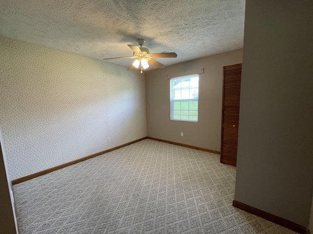 1830 Pheasant Crossing Dr, Dandridge, TN 37725 - unfurnished room featuring ceiling fan, light carpet, a textured ceiling, and wallpapered walls