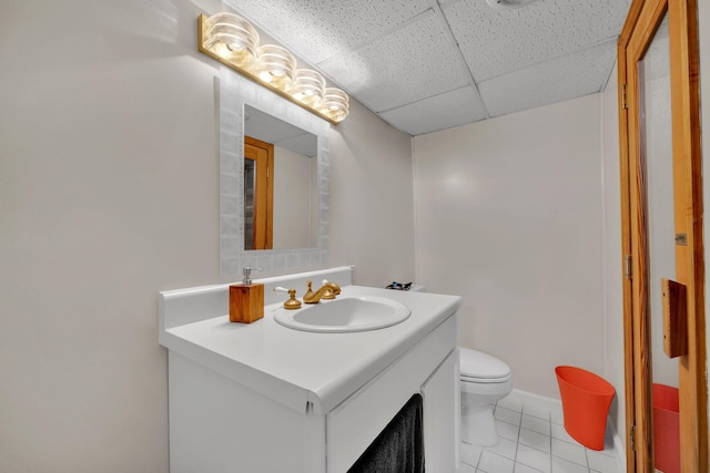 1216 Winding Dr, Sevierville, TN 37876 - bathroom with a drop ceiling, tile patterned flooring, vanity, and toilet