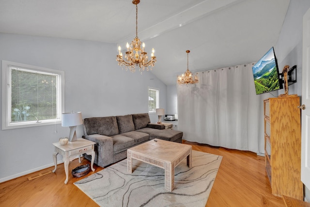 1216 Winding Dr, Sevierville, TN 37876 - living area featuring a chandelier, wood finished floors, and baseboards
