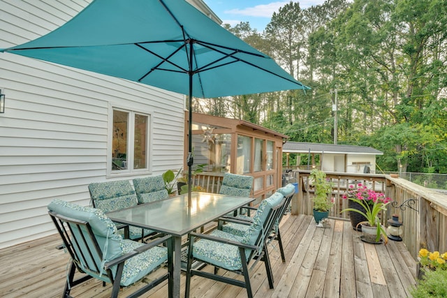 1216 Winding Dr, Sevierville, TN 37876 - wooden terrace featuring outdoor dining area and view of wooded area