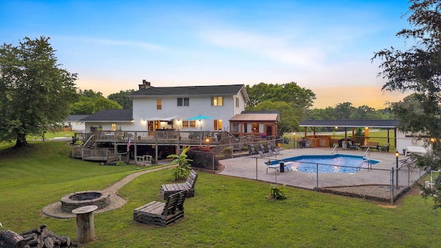 1216 Winding Dr, Sevierville, TN 37876 - view of pool with an outdoor fire pit, a deck, a patio, and stairs