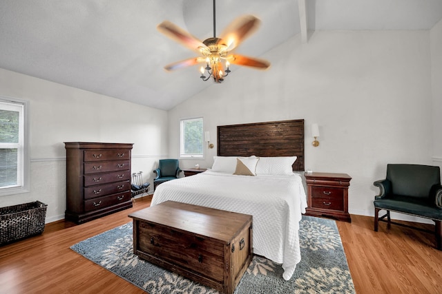 1216 Winding Dr, Sevierville, TN 37876 - bedroom featuring wood finished floors, beamed ceiling, a ceiling fan, and high vaulted ceiling