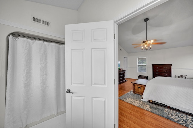 1216 Winding Dr, Sevierville, TN 37876 - bedroom featuring wood finished floors, lofted ceiling, and ceiling fan