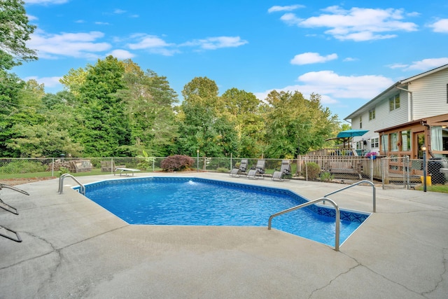 1216 Winding Dr, Sevierville, TN 37876 - view of swimming pool featuring a patio and a wooden deck