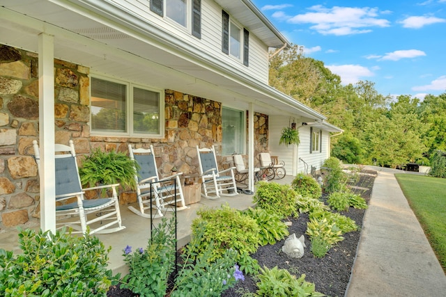 1216 Winding Dr, Sevierville, TN 37876 - entrance to property featuring covered porch and stone siding
