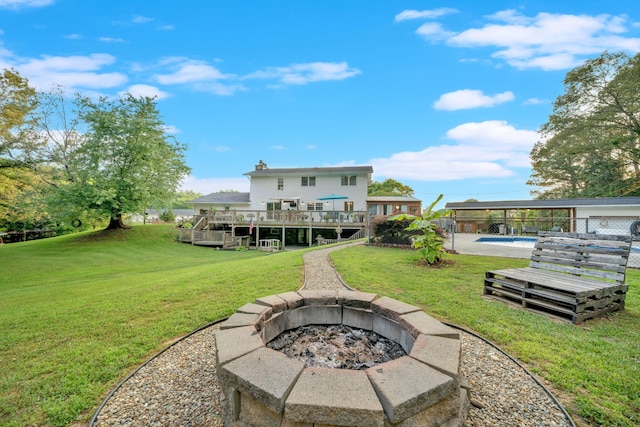 1216 Winding Dr, Sevierville, TN 37876 - back of house with a wooden deck, a fire pit, a lawn, and stairs