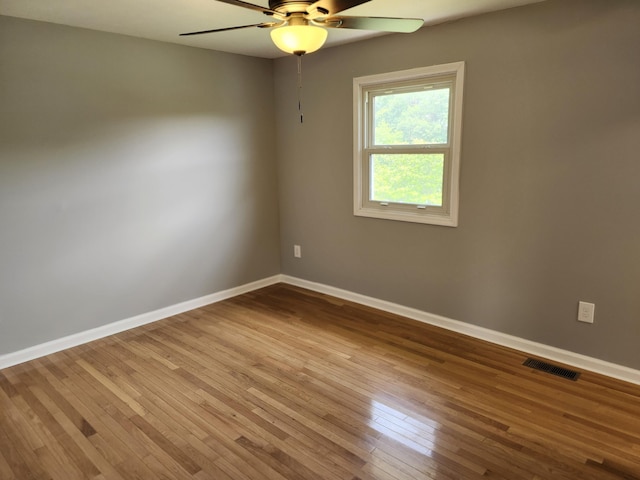 unfurnished room featuring ceiling fan and light hardwood / wood-style floors