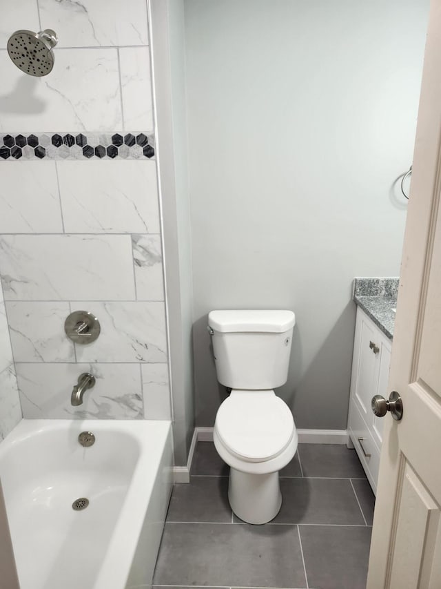 full bathroom with tile patterned floors, vanity, toilet, and tiled shower / bath