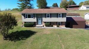 bi-level home with a front yard