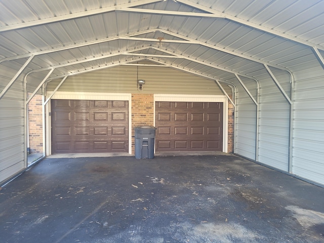 garage featuring a carport