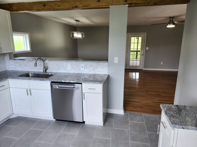 kitchen with white cabinets, stainless steel dishwasher, hanging light fixtures, and sink