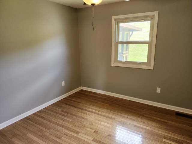 unfurnished room with light hardwood / wood-style floors