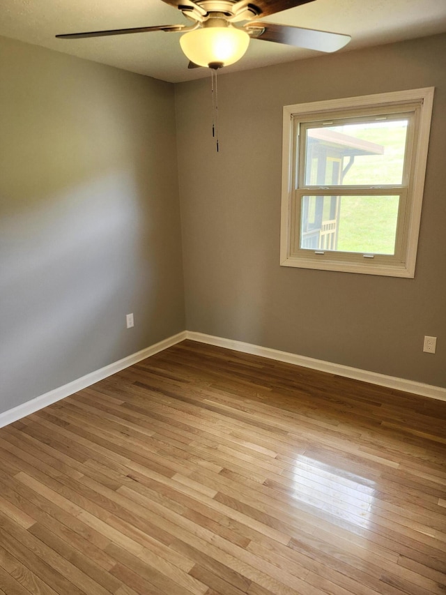 unfurnished room with ceiling fan and light hardwood / wood-style flooring