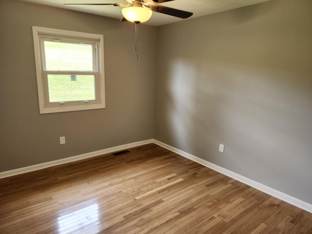 spare room with light hardwood / wood-style flooring and ceiling fan