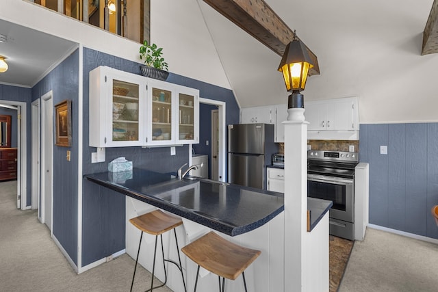 1116 Patterson St, Dandridge, TN 37725 - kitchen with stainless steel appliances, light carpet, a peninsula, white cabinets, and glass insert cabinets