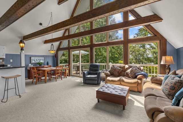 1116 Patterson St, Dandridge, TN 37725 - living area featuring light colored carpet, beamed ceiling, and high vaulted ceiling