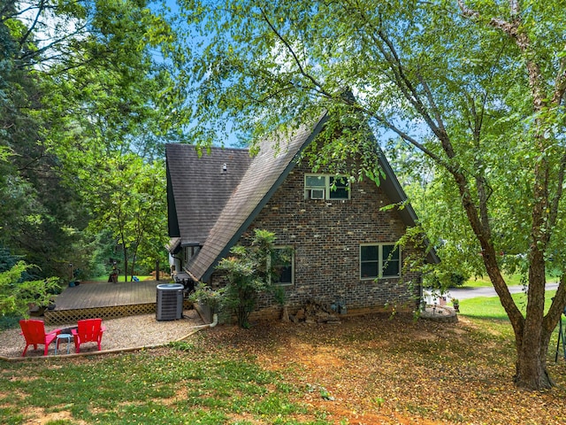 1116 Patterson St, Dandridge, TN 37725 - view of side of home featuring brick siding and a wooden deck