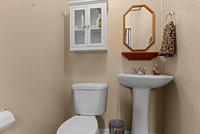 bathroom featuring toilet