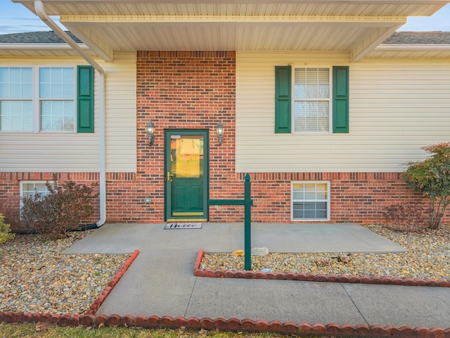 entrance to property with a patio area