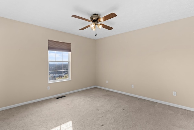 empty room with light carpet and ceiling fan