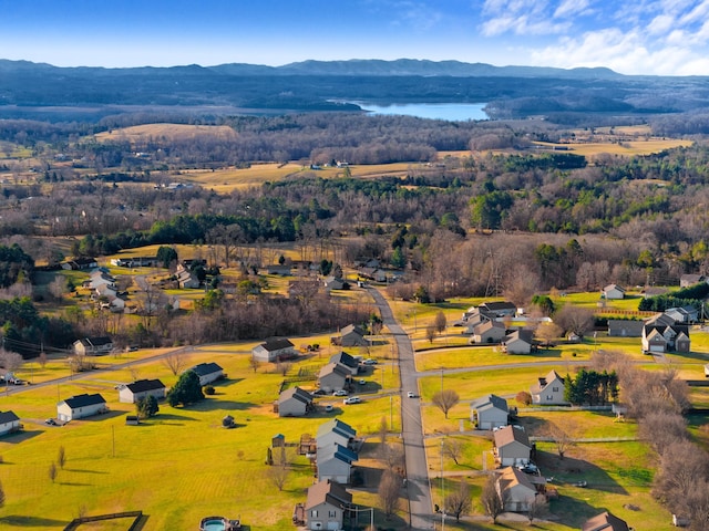 bird's eye view with a water and mountain view