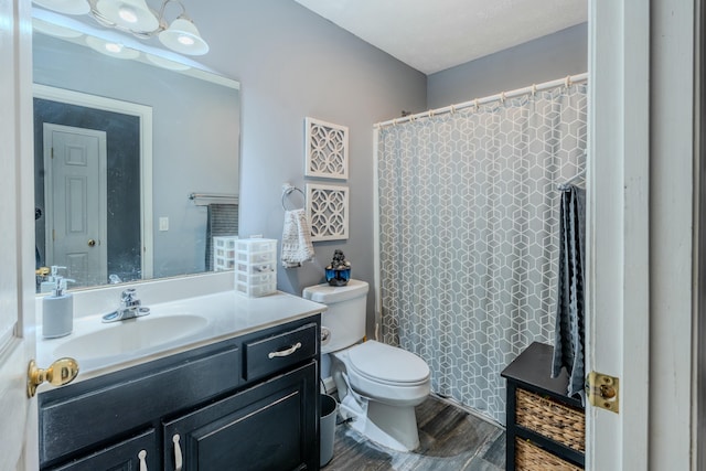 bathroom with hardwood / wood-style flooring, vanity, toilet, and a shower with shower curtain