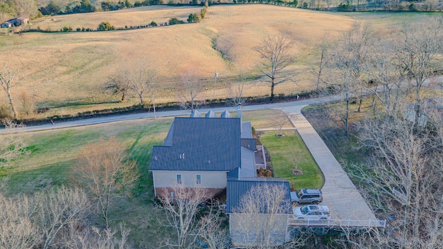 birds eye view of property with a rural view