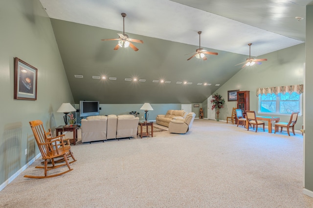 carpeted living room with high vaulted ceiling