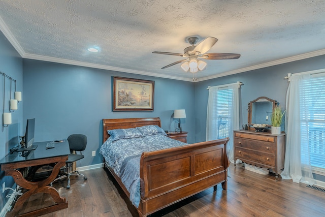 bedroom with dark hardwood / wood-style flooring, multiple windows, ornamental molding, and a textured ceiling