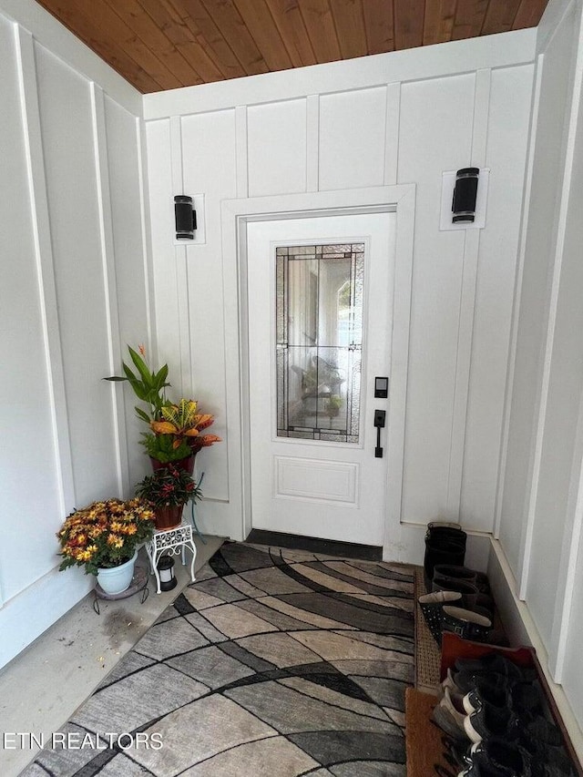 view of exterior entry featuring board and batten siding