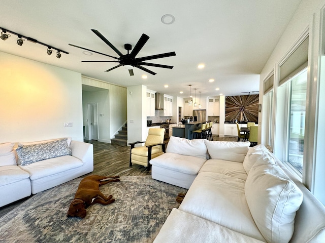 living area with recessed lighting, dark wood-style floors, stairs, and ceiling fan