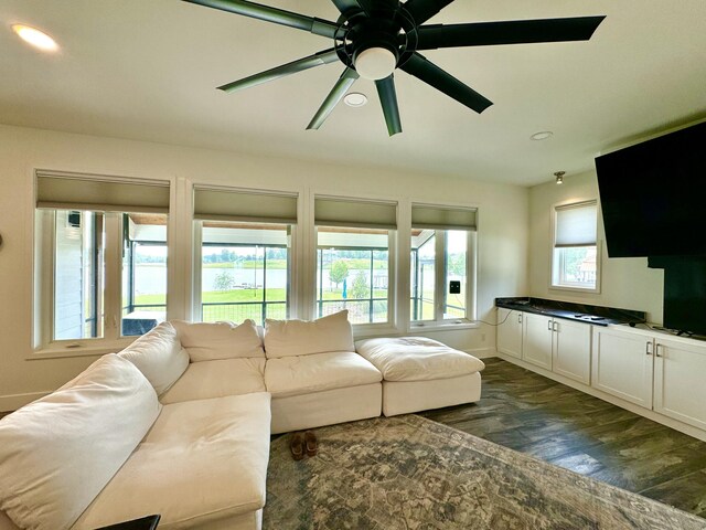 living room with dark wood-style flooring, recessed lighting, a ceiling fan, and baseboards