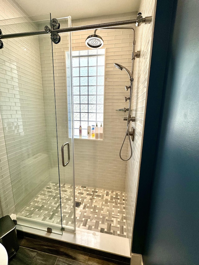 full bath featuring a shower stall