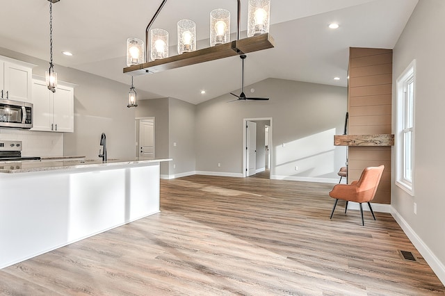 518 Deborahs Way, Greeneville, TN 37743 - kitchen featuring appliances with stainless steel finishes, a sink, white cabinets, light wood-style floors, and open floor plan