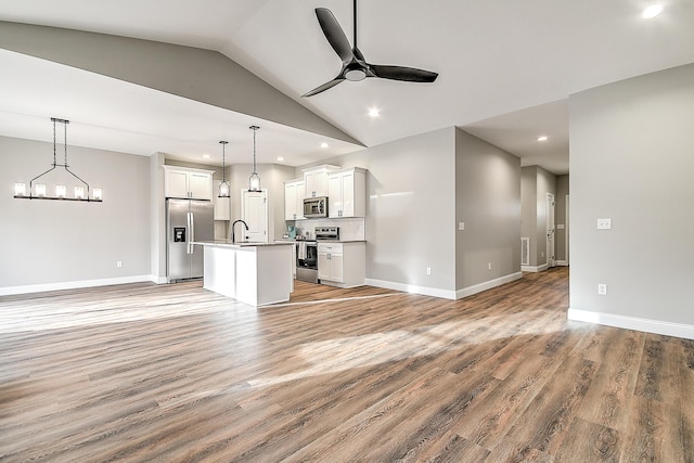 518 Deborahs Way, Greeneville, TN 37743 - unfurnished living room featuring ceiling fan, light wood finished floors, recessed lighting, vaulted ceiling, and baseboards