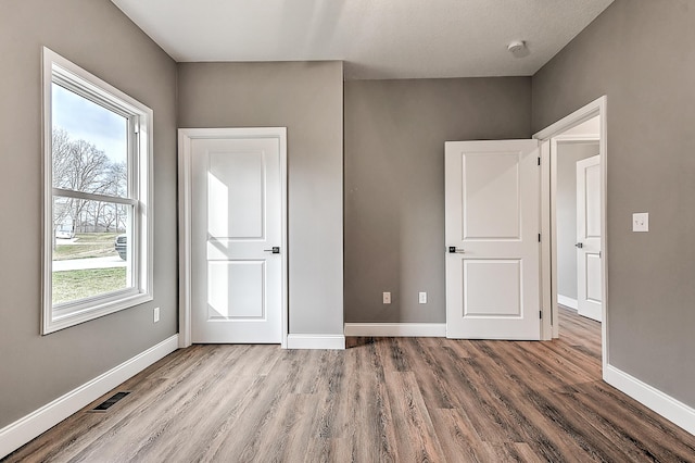 518 Deborahs Way, Greeneville, TN 37743 - unfurnished bedroom featuring wood finished floors and baseboards