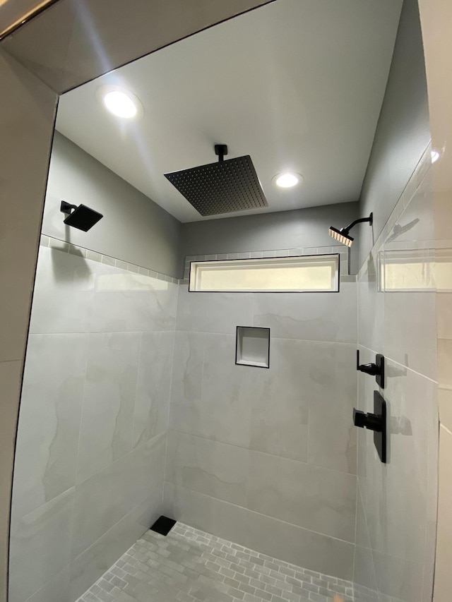 bathroom with tiled shower