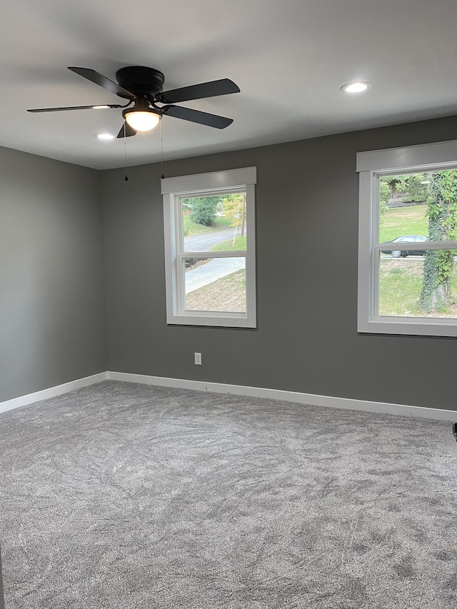 carpeted empty room with ceiling fan