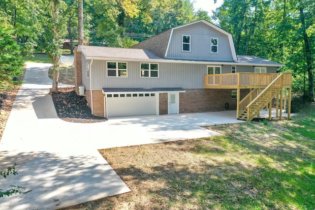 front of property featuring a garage and a deck