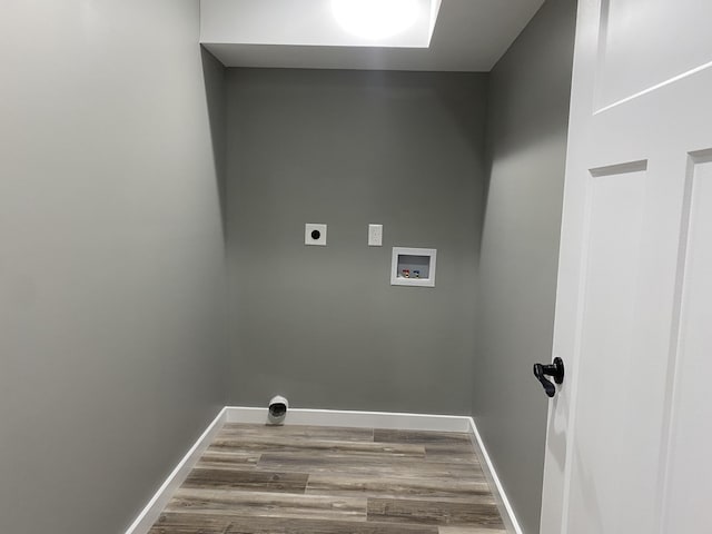 washroom featuring hardwood / wood-style floors, electric dryer hookup, and hookup for a washing machine