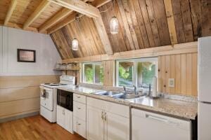 kitchen featuring lofted ceiling with beams, wooden ceiling, white appliances, a sink, and light countertops