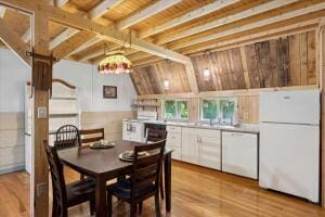 dining space with wood finished floors