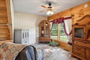 living room with a ceiling fan and wood finished floors