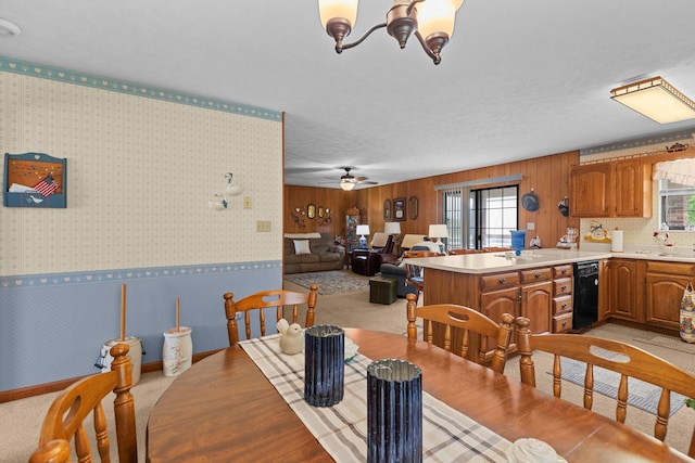 4715/4685 Old Kentucky Rd, Morristown, TN 37814 - dining area with a chandelier, wallpapered walls, light carpet, a ceiling fan, and wood walls